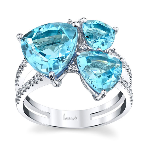 14Kt White Gold Contemporary Three Stone Design of Trillion Shaped Blue Topaz and Diamond Ring